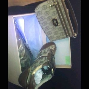 MK sneakers and small bag